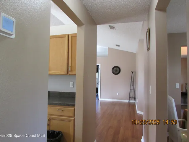 a kitchen with stainless steel appliances granite countertop a refrigerator and a stove