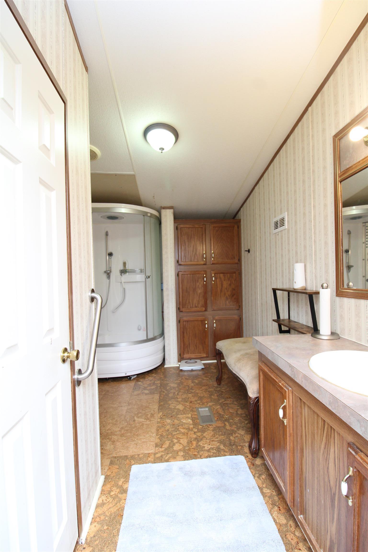 183 Henry Road Goodlettsville, TN 37072 - Photo 11 of 12 a spacious bathroom with a tub sink and mirror