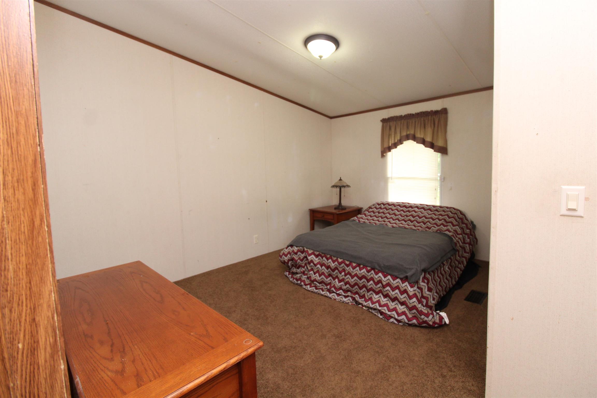 183 Henry Road Goodlettsville, TN 37072 - Photo 4 of 12 a bedroom with a bed and a dresser