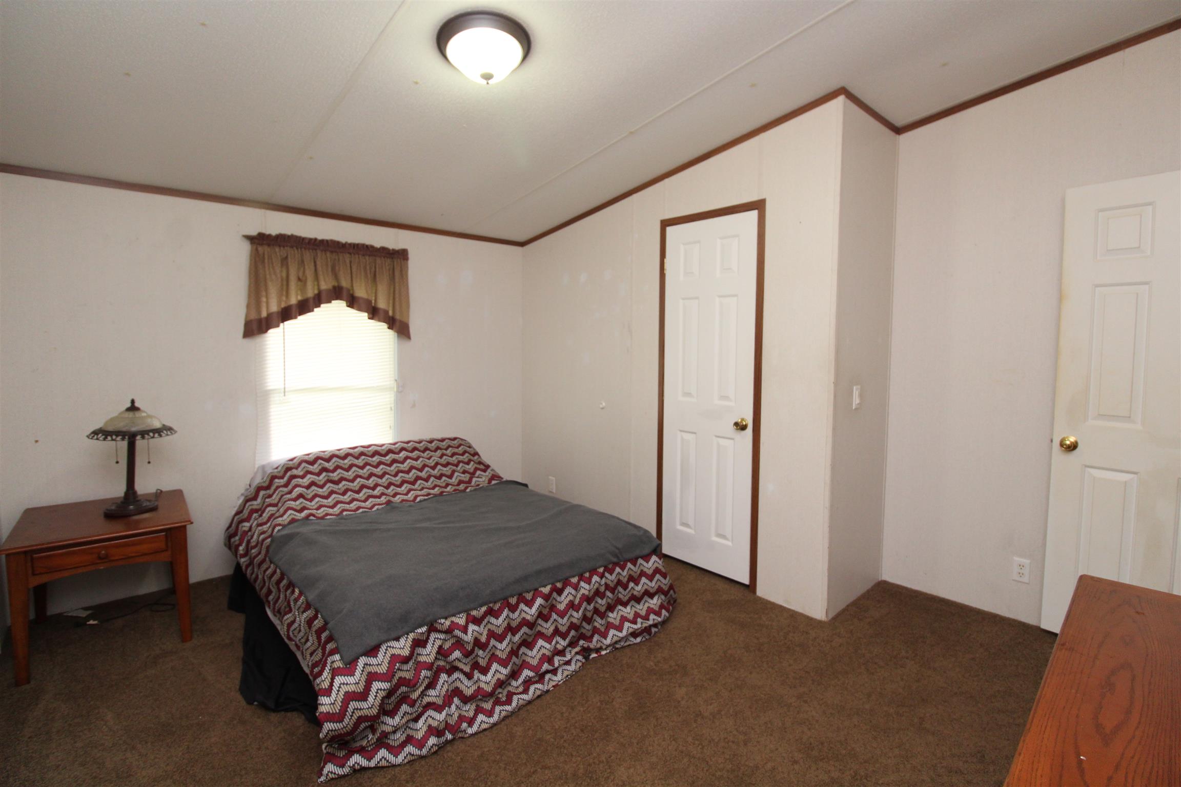 183 Henry Road Goodlettsville, TN 37072 - Photo 5 of 12 a bedroom with a bed and a window