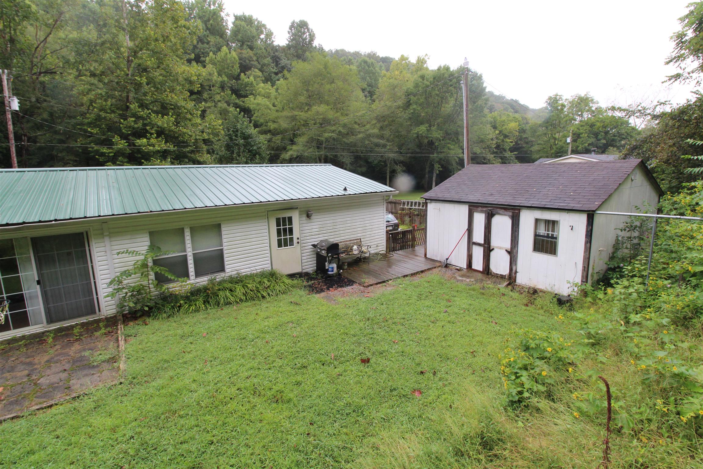 183 Henry Road Goodlettsville, TN 37072 - Photo 6 of 12 a view of a house with backyard and garden