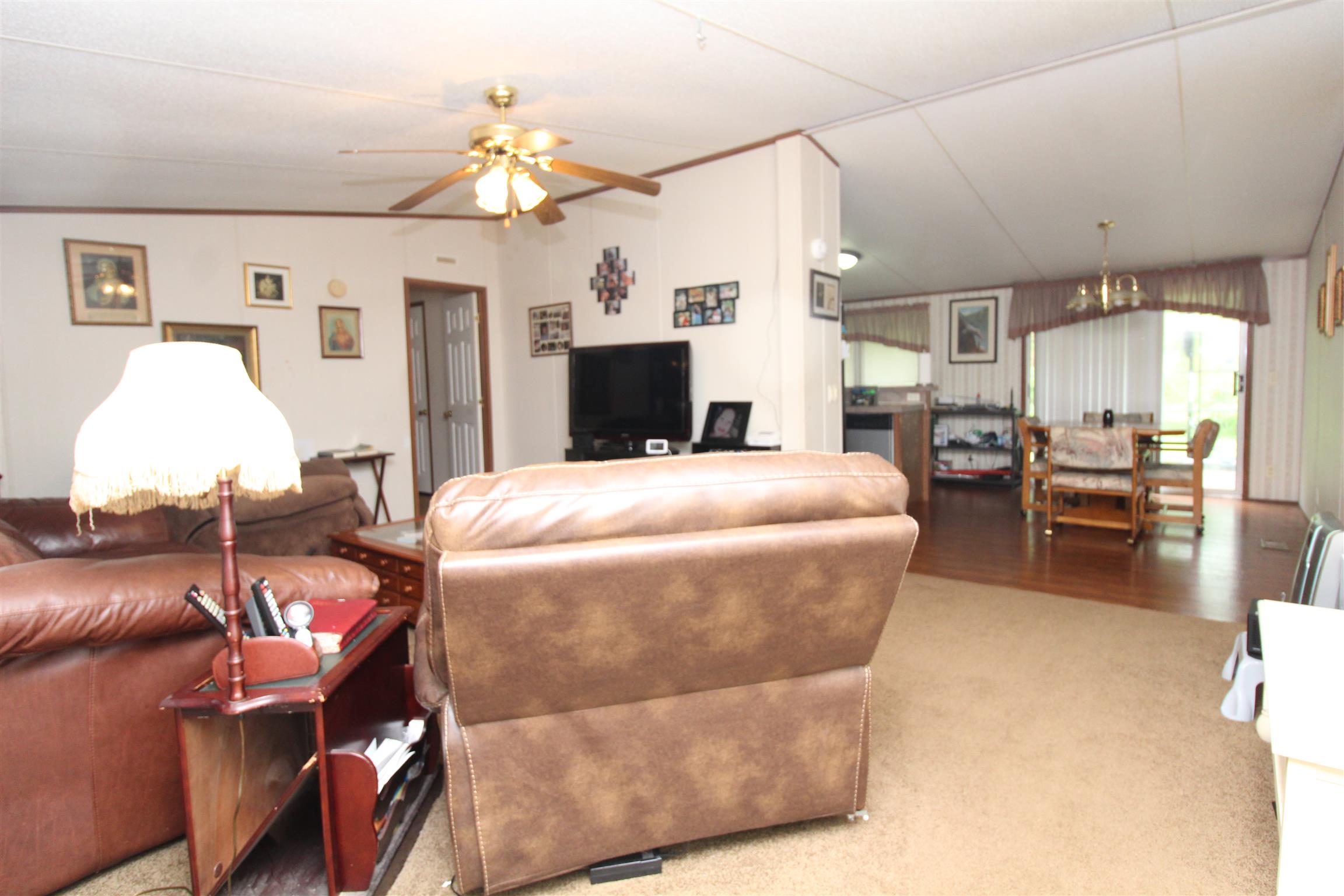 183 Henry Road Goodlettsville, TN 37072 - Photo 7 of 12 a living room with furniture and a chandelier