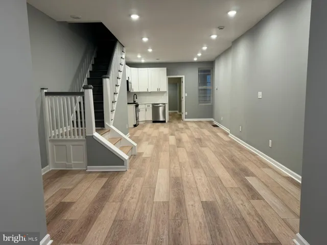 a view of kitchen with wooden floor and window