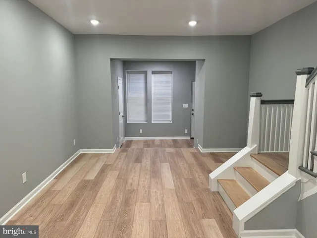 a view of a room with wooden floor and chair