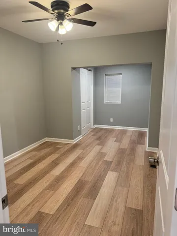 a view of a room with a ceiling fan