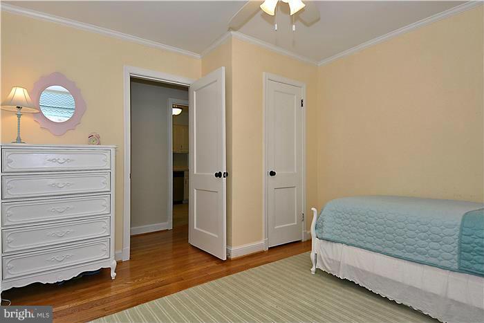 1003 Strout Street Silver Spring, MD 20901 - Photo 17 of 28 a bedroom with a bed and cabinets