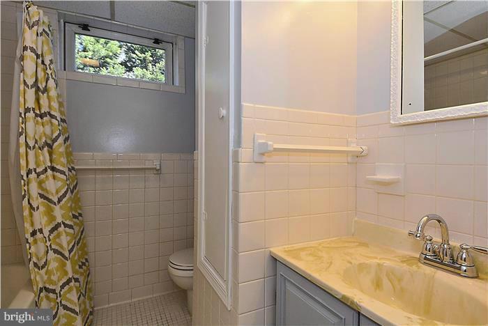 1003 Strout Street Silver Spring, MD 20901 - Photo 24 of 28 a bathroom with a sink toilet and shower