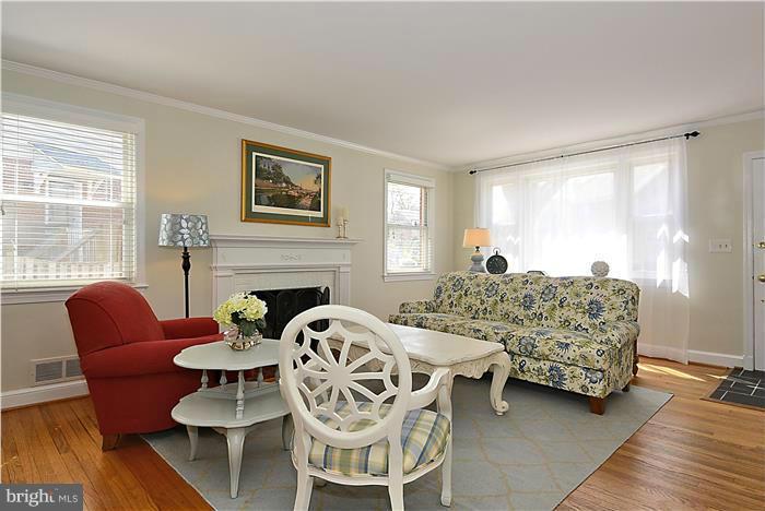 1003 Strout Street Silver Spring, MD 20901 - Photo 4 of 28 a living room with furniture and a fireplace