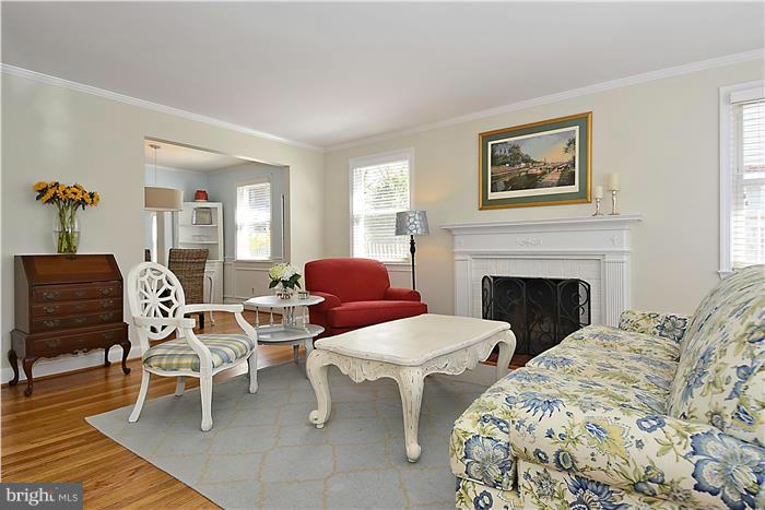 1003 Strout Street Silver Spring, MD 20901 - Photo 5 of 28 a living room with furniture and a fireplace