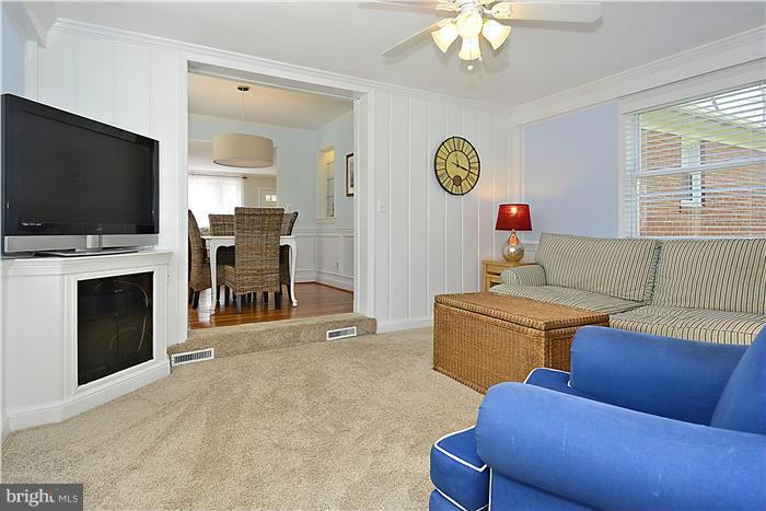 1003 Strout Street Silver Spring, MD 20901 - Photo 10 of 28 a living room with furniture and a flat screen tv