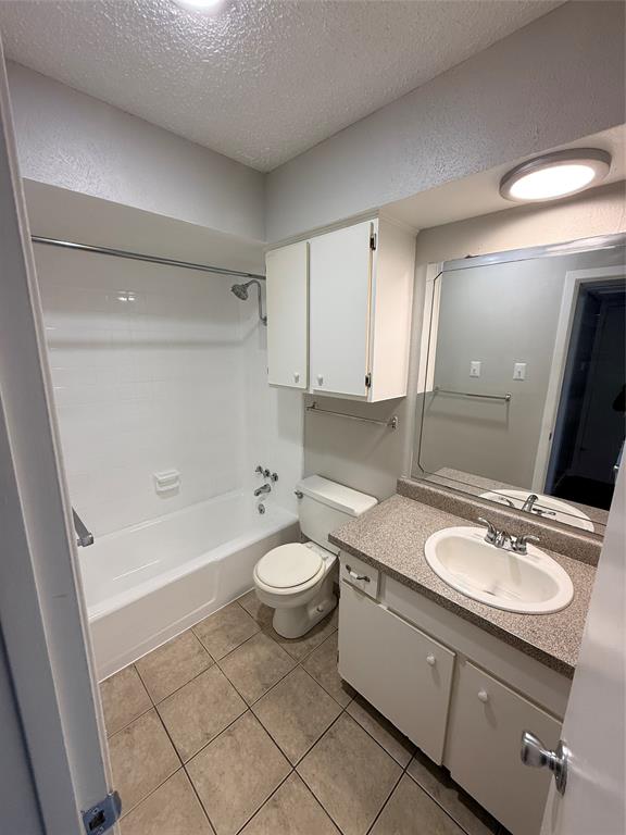 1000 West Spring Valley Road Richardson, TX 75080 - Photo 5 of 7 a bathroom with a sink a toilet and shower