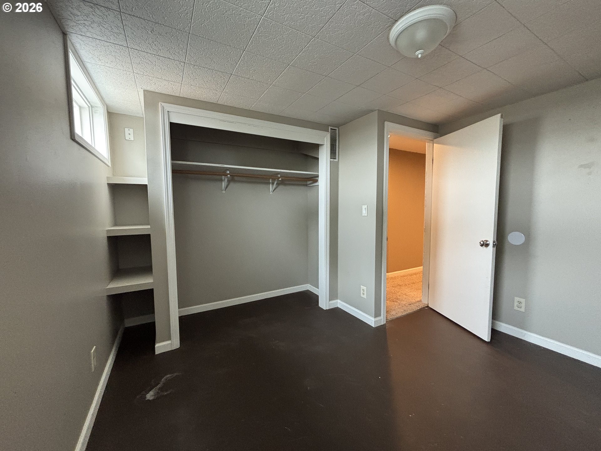 924 Southwest 33rd Street Pendleton, OR 97801 - Photo 22 of 27 an empty room with a fireplace and wooden shelves