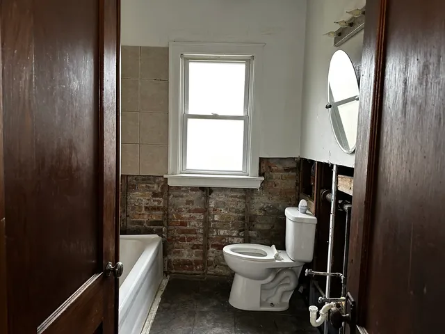 a bathroom with a toilet and a sink