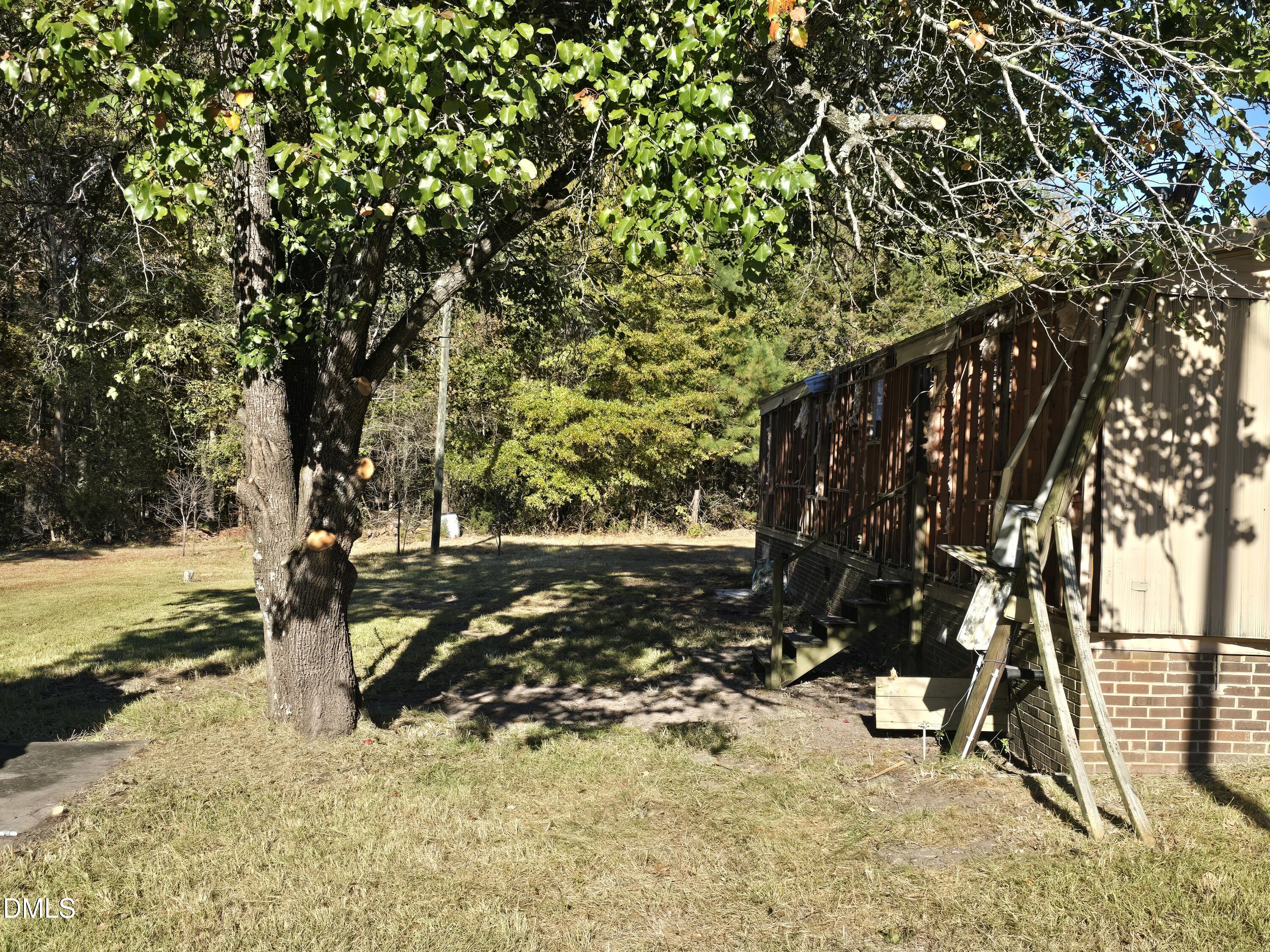 1862 Miles Chapel Road Mebane, NC 27302 - Photo 10 of 20 a view of a yard with wooden fence