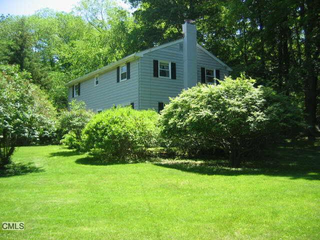 316 Danbury Road Ridgefield, CT 06877 - Photo 1 of 1 a view of a house with a yard
