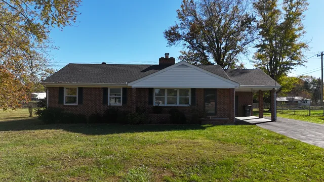 a balcony with next to a yard