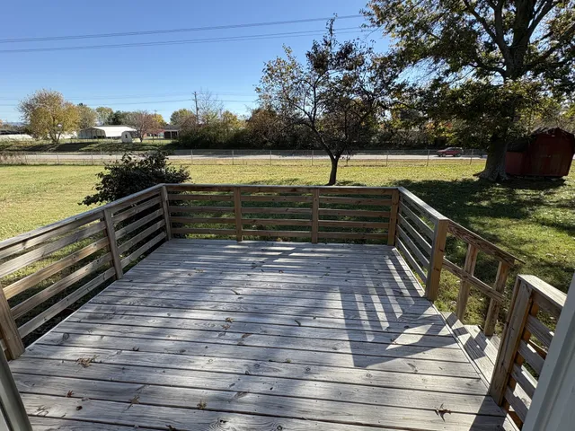 a view of outdoor space with garden and trees