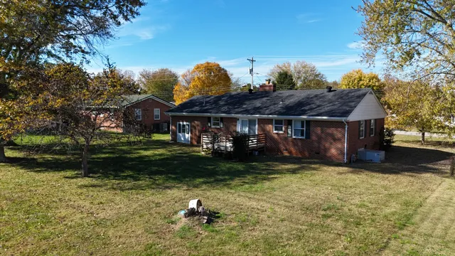 a view of swimming pool with a yard