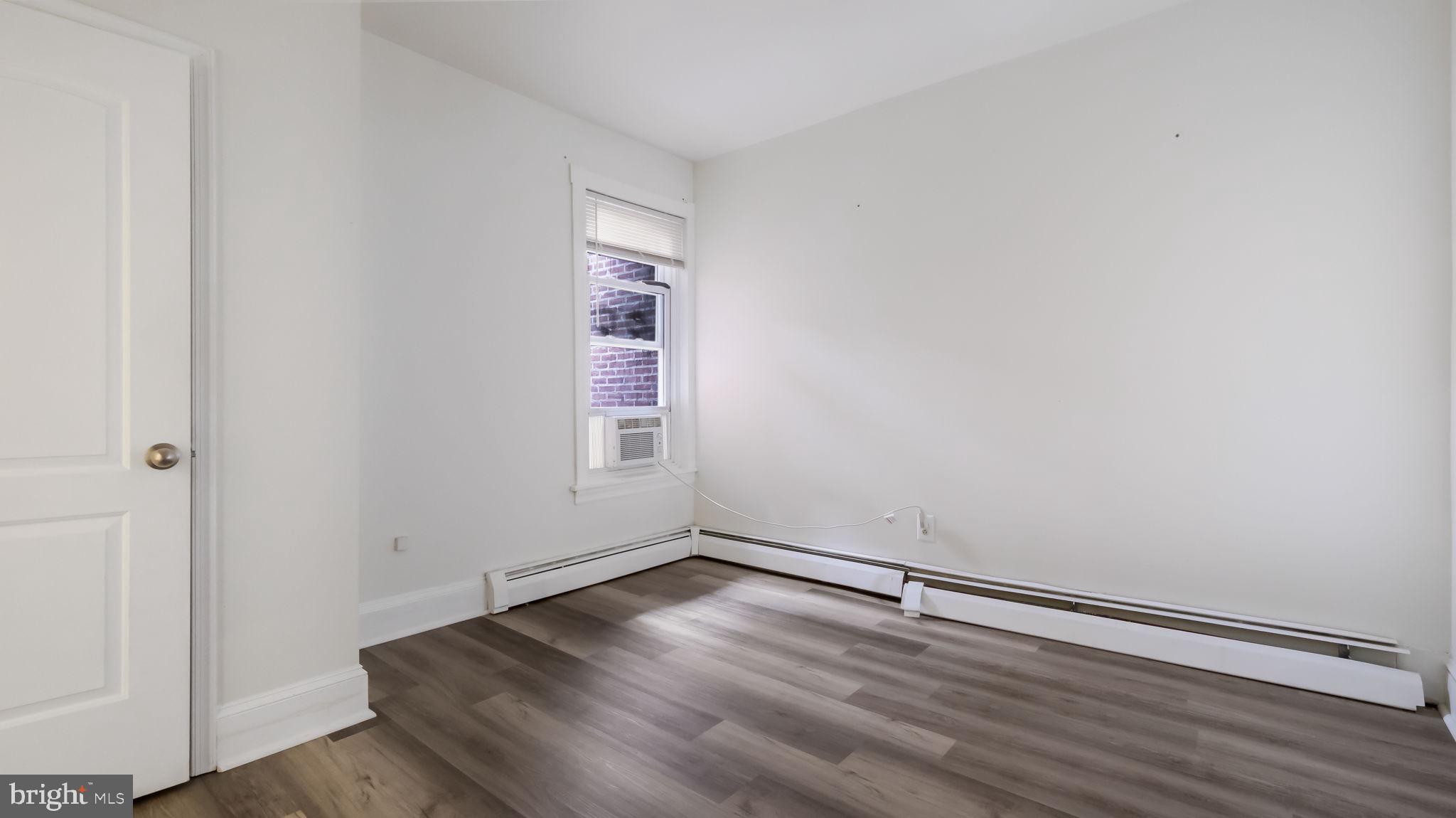 4 West State Street, Unit B Media, PA 19063 - Photo 5 of 14 an empty room with wooden floor and windows