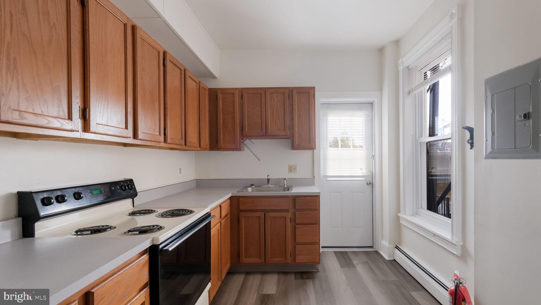 4 West State Street, Unit B Media, PA 19063 - Photo 9 of 14 a kitchen with stainless steel appliances granite countertop a stove and a refrigerator