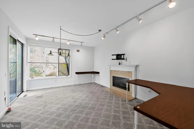 a view of a kitchen with furniture and a fireplace