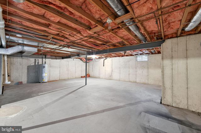 a view of empty room with wooden walls