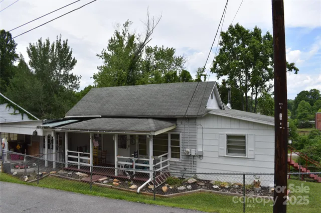 a view of yard from deck having patio