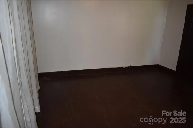 a living room with furniture and a chair