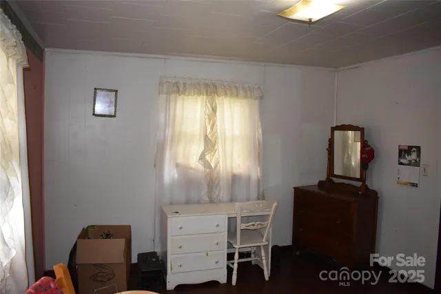 a view of a livingroom with furniture and a flat screen tv