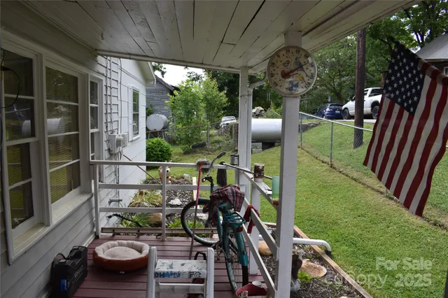 a living room with furniture and a ceiling fan