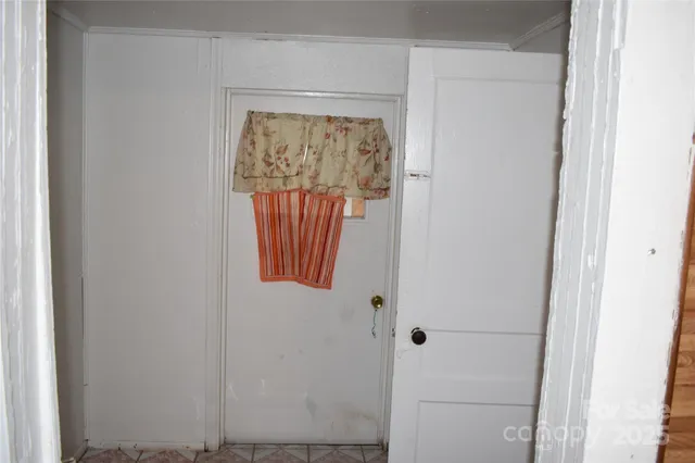 a view of a kitchen with a table and chairs