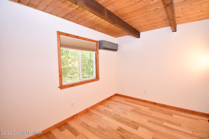 1239 Glenbrook Road Bartonsville, PA 18321 - Photo 16 of 32 a view of empty room with wooden floor and fan