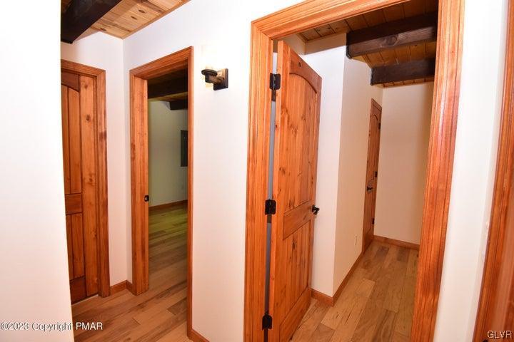 1239 Glenbrook Road Bartonsville, PA 18321 - Photo 22 of 32 a view of a hallway with wooden floor and staircase