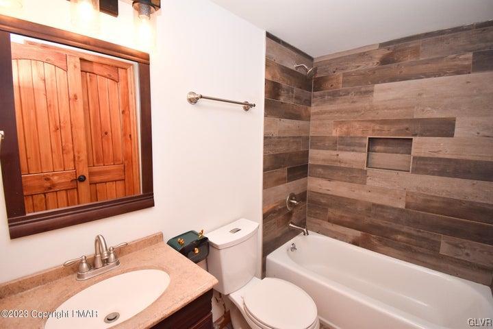 1239 Glenbrook Road Bartonsville, PA 18321 - Photo 24 of 32 a bathroom with a sink toilet and shower