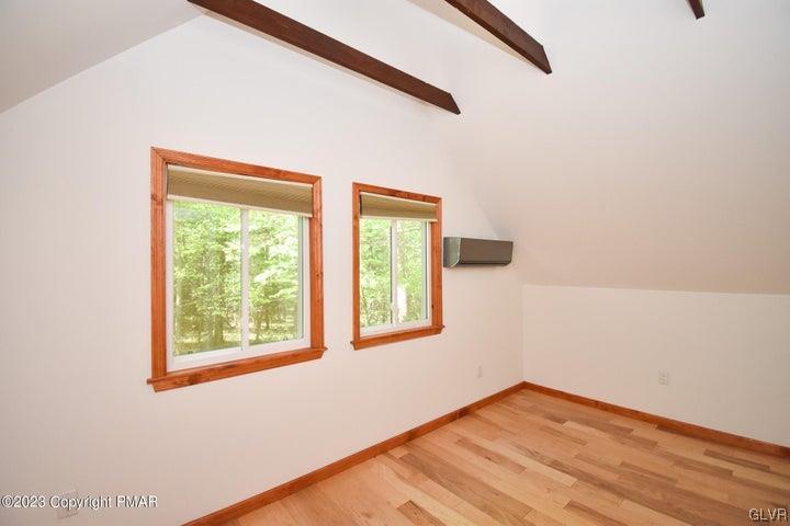 1239 Glenbrook Road Bartonsville, PA 18321 - Photo 27 of 32 a view of an empty room with wooden floor and a window