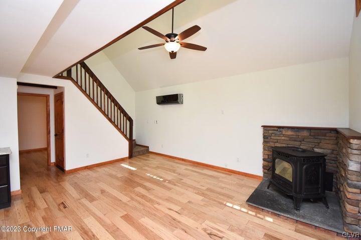 1239 Glenbrook Road Bartonsville, PA 18321 - Photo 6 of 32 a living room with wooden floor and a ceiling fan