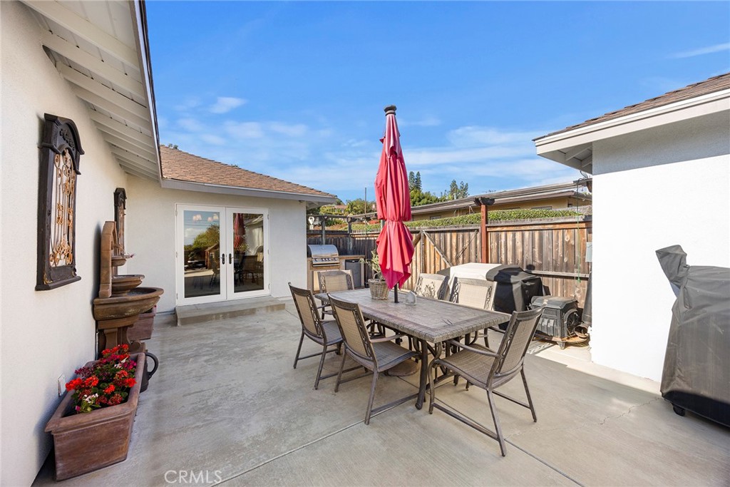 15914 West Road Whittier, CA 90603 - Photo 38 of 47 a view of a dining table and chairs in the patio