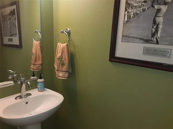 a bathroom with a sink and mirror