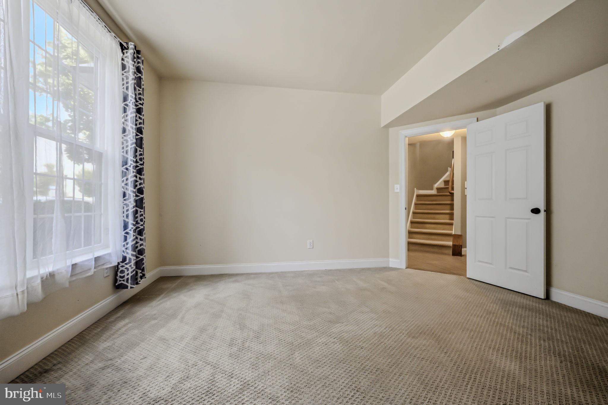 208 Jackdaw Alley, Unit 208 Springfield, PA 19064 - Photo 24 of 49 a view of an empty room with a fireplace