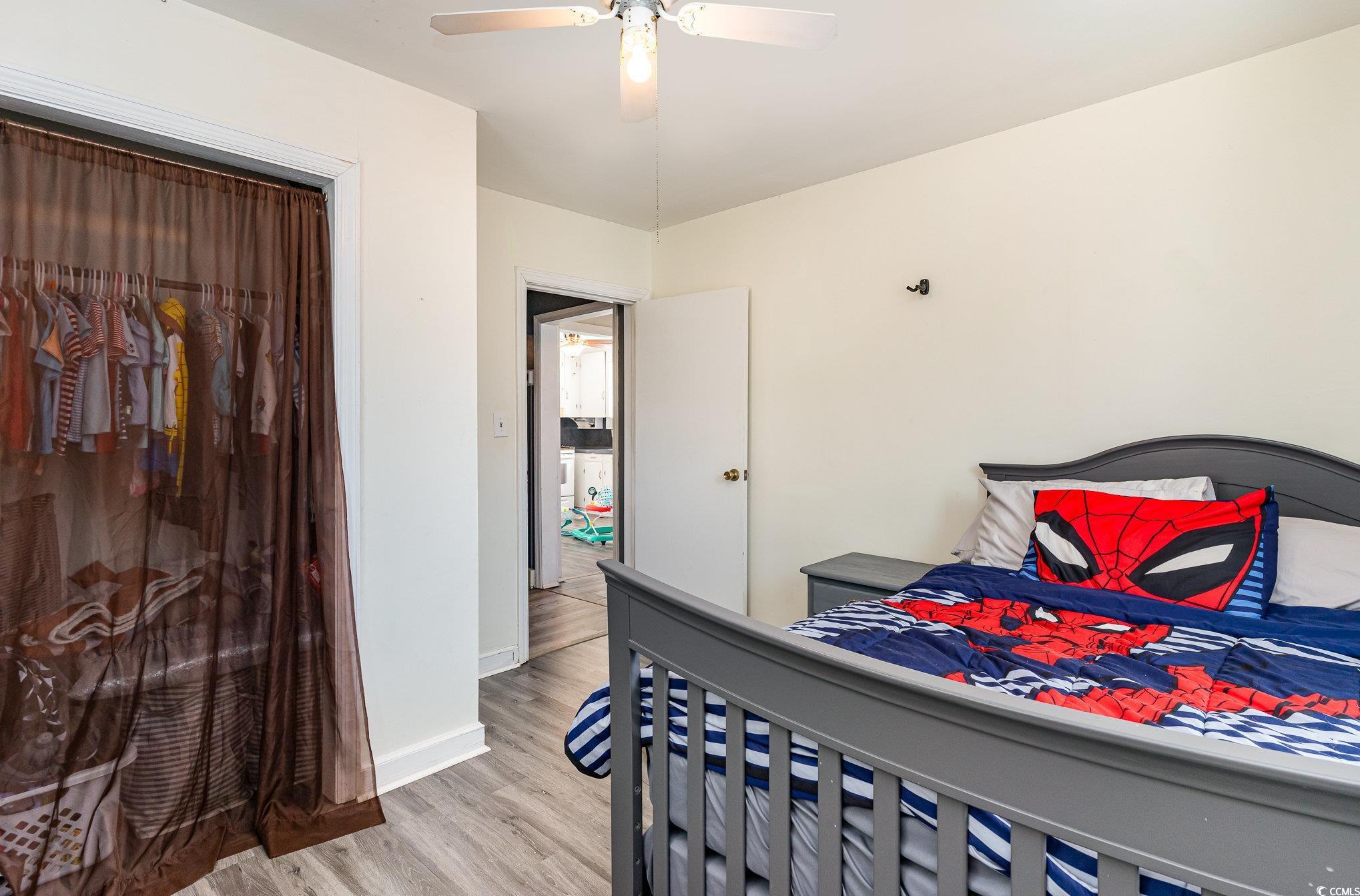 606 Britt Street Georgetown, SC 29440 - Photo 19 of 28 Bedroom with a ceiling fan, baseboards, and light