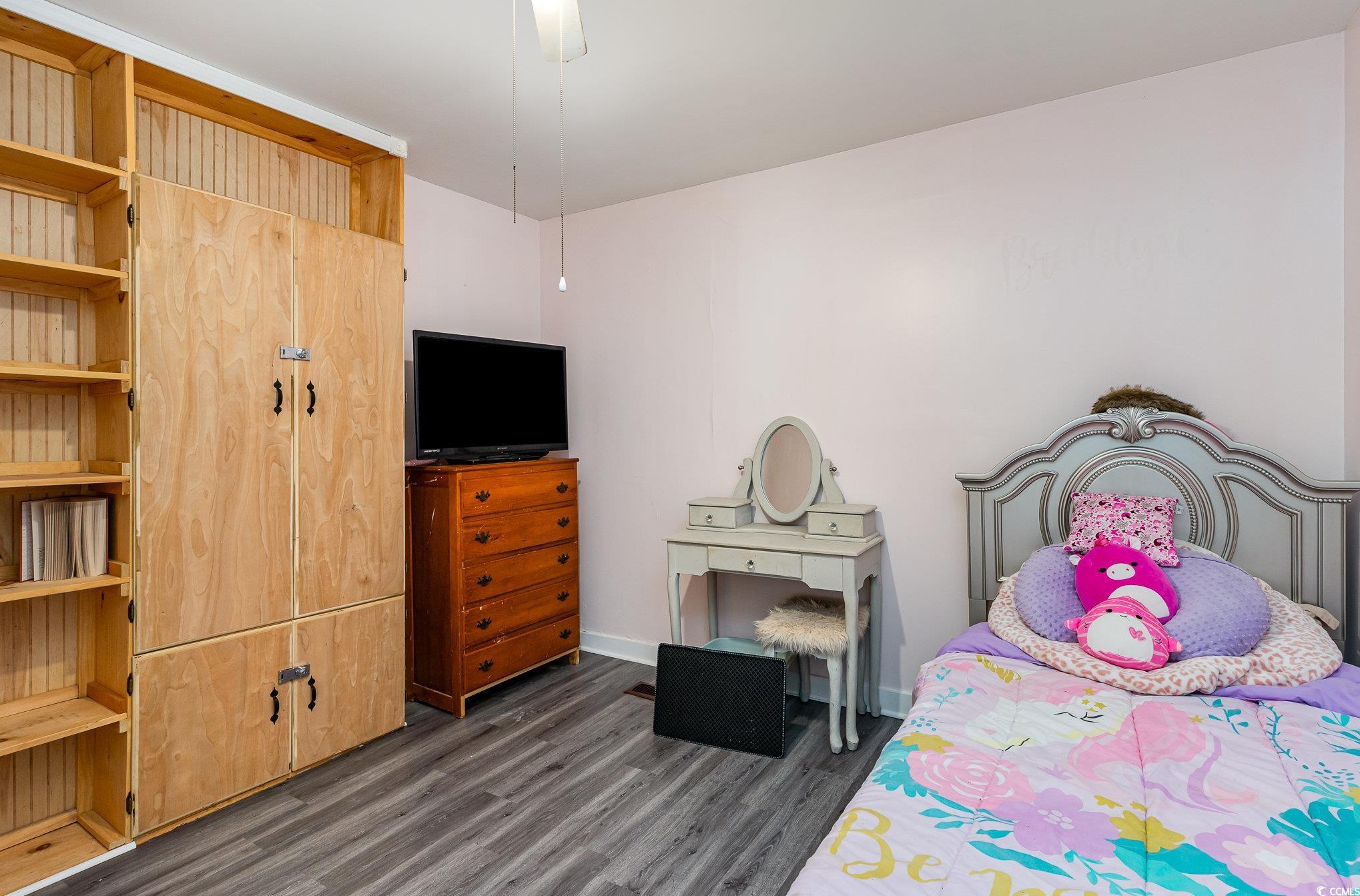 606 Britt Street Georgetown, SC 29440 - Photo 20 of 28 Bedroom with wood finished floors and baseboards
