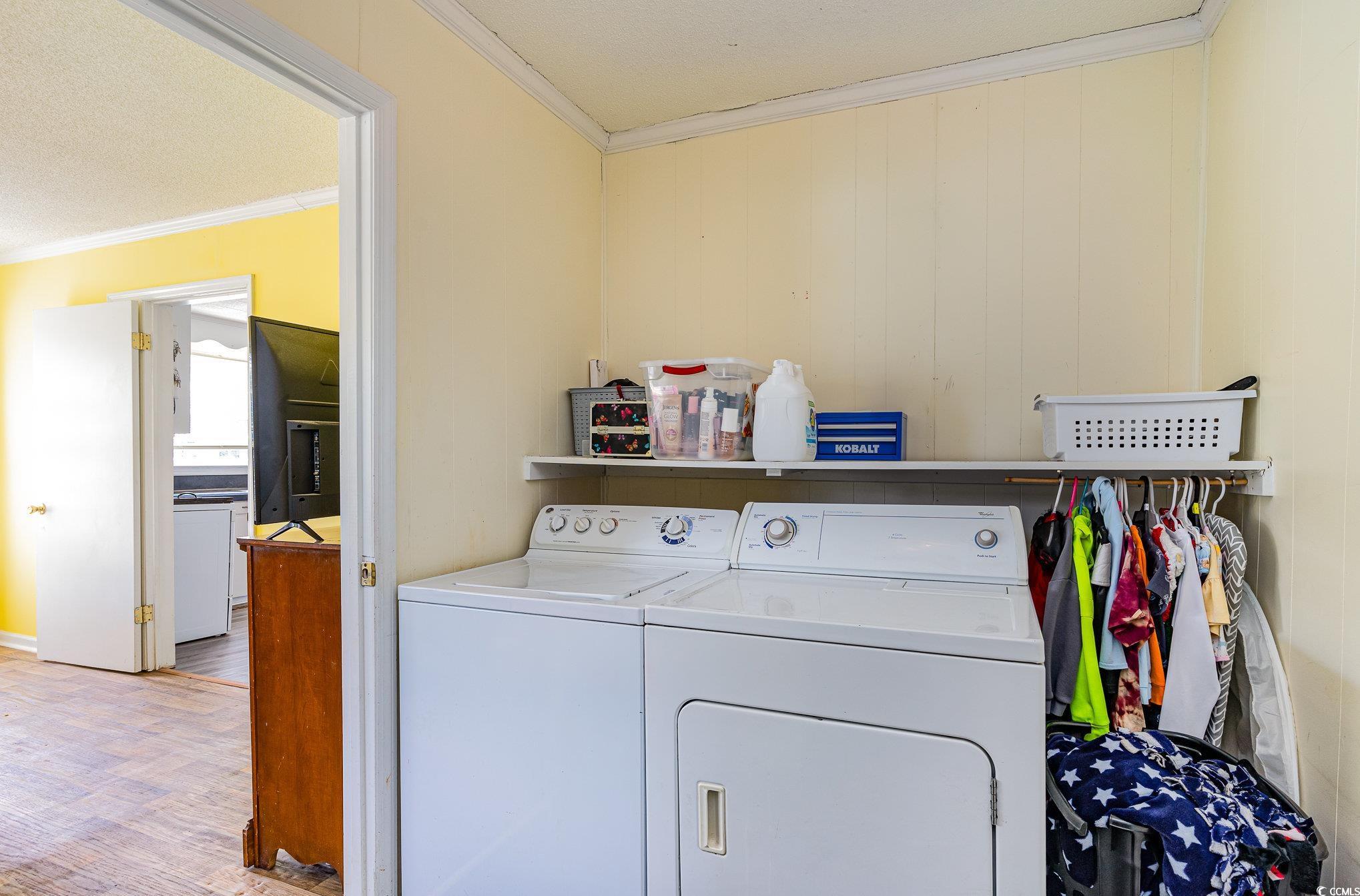 606 Britt Street Georgetown, SC 29440 - Photo 22 of 28 Clothes washing area with light wood-style floors,