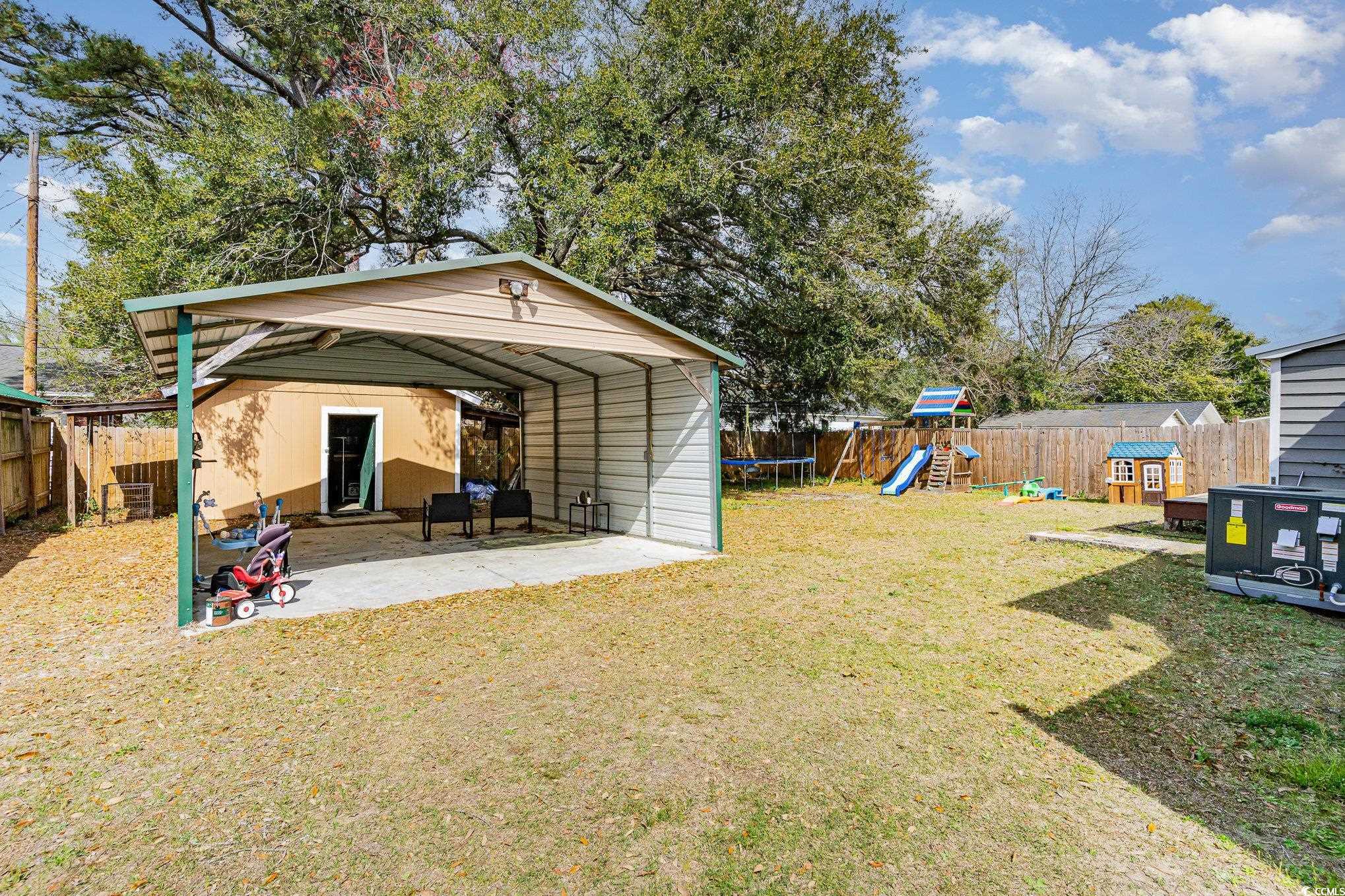 606 Britt Street Georgetown, SC 29440 - Photo 26 of 28 View of yard featuring a fenced backyard, a patio,