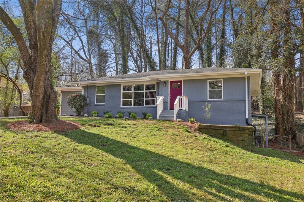 2477 Rockcliff Road Southeast Atlanta, GA 30316 - Photo 1 of 1 front view of a house with a yard