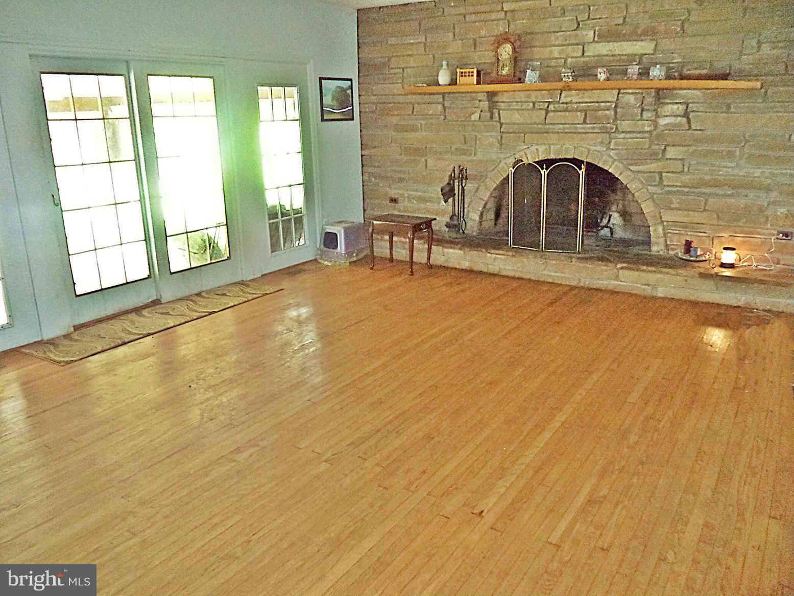 360 Jones Station Road Arnold, MD 21012 - Photo 16 of 30 WARMING STONE-HEARTH FIREPLACE and French Sliders
