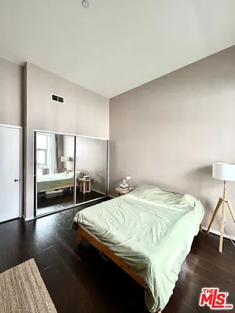 a bedroom with a bed and a table