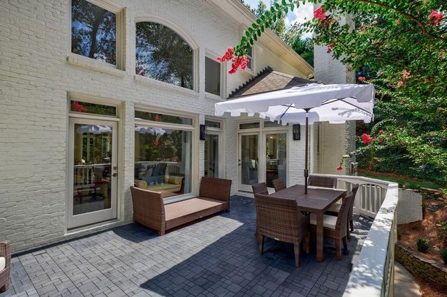 a reading room with furniture and a window