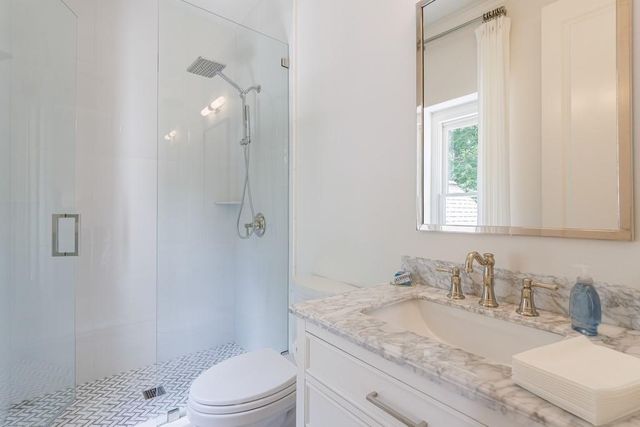 a view of a patio with a table chairs and a backyard