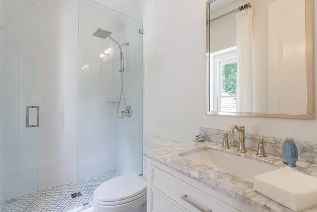 a view of a patio with a table chairs and a backyard