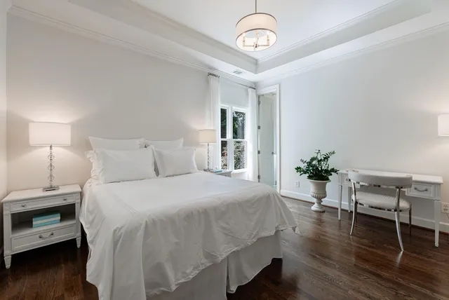 an aerial view of residential house with outdoor space and trees all around